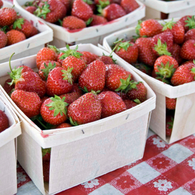 multiple baskets of in season strawberries